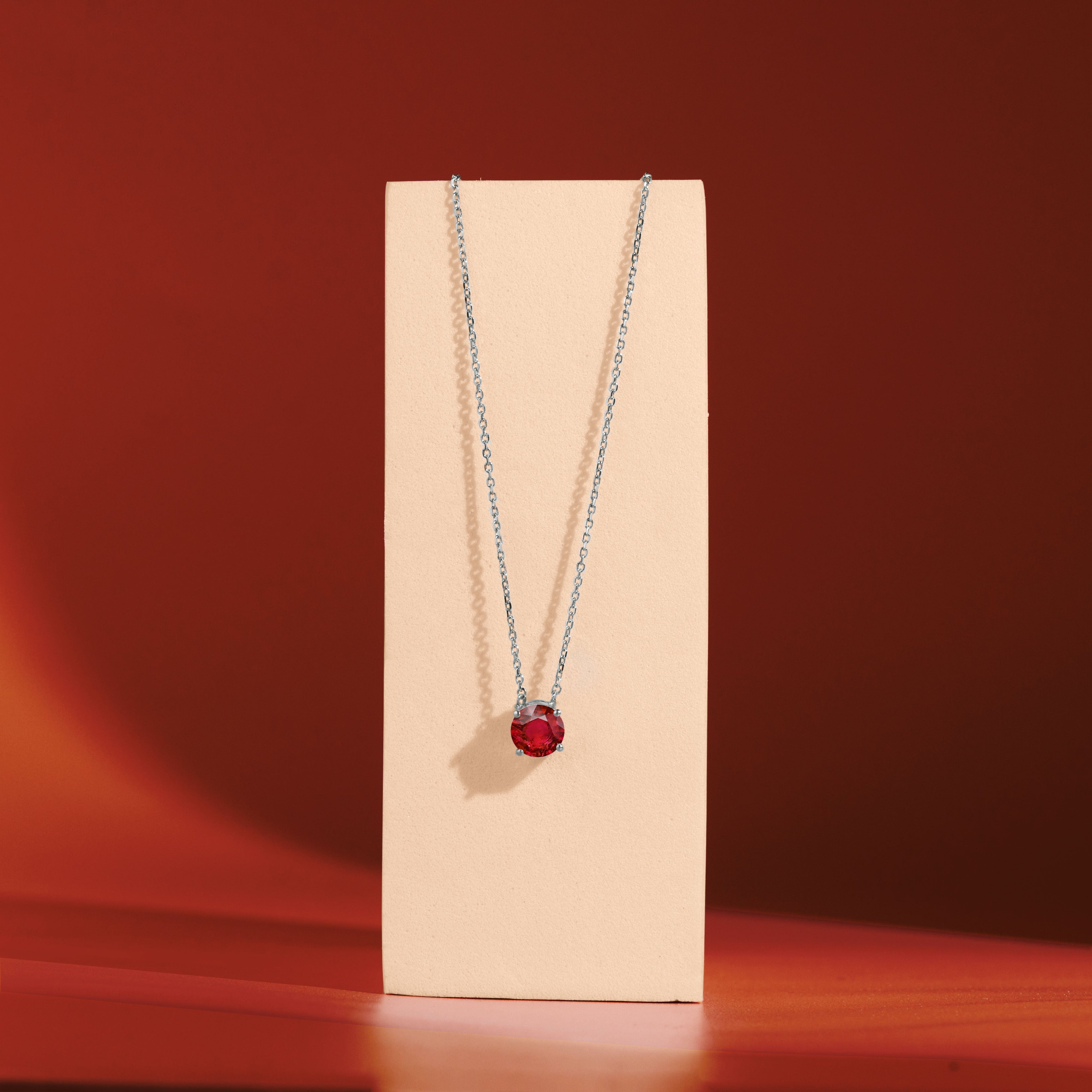 1 Carat Round Cut Lab-Created Ruby Solitaire Pendant Necklace in 18k White Gold Over Silver