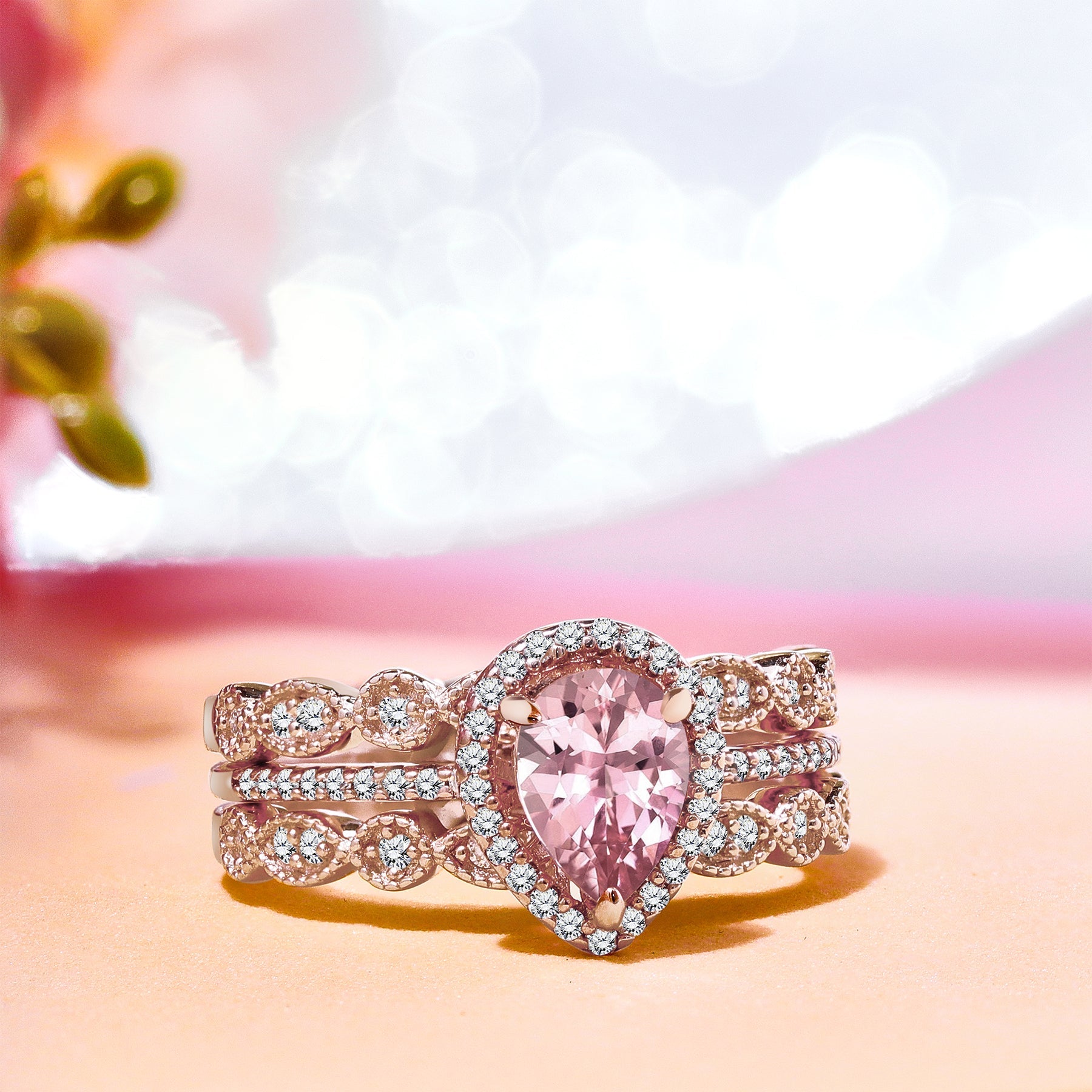 1.25 Carat Pear Cut created Morganite and Moissanite Trio Wedding Ring Set in 18k Rose Gold over Silver