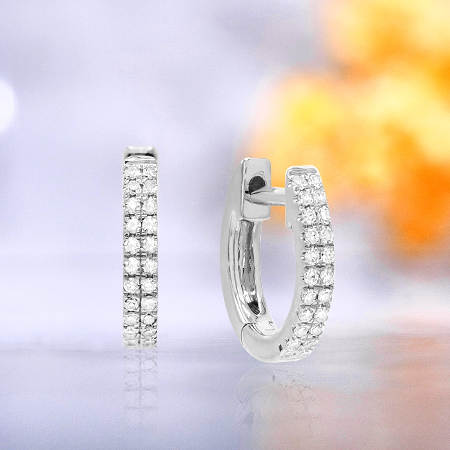 Petite 1.2 Carat Double Row Moissanite Huggie Earrings in 18K White Gold over Silver.