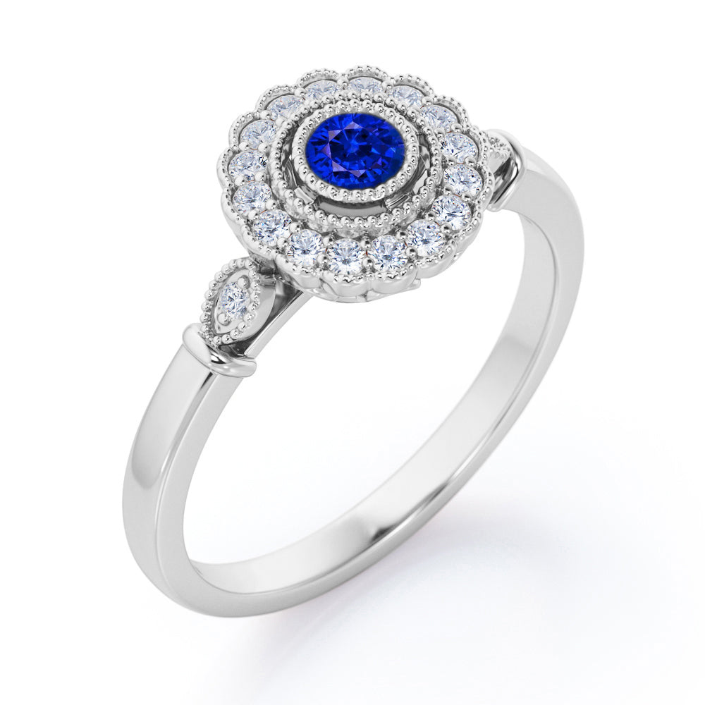 Milgrain Flower Halo 1.2 carat Carat Round Brilliant Cut Blue Sapphire and diamond Trilogy Bezel Engagement Ring in White Gold