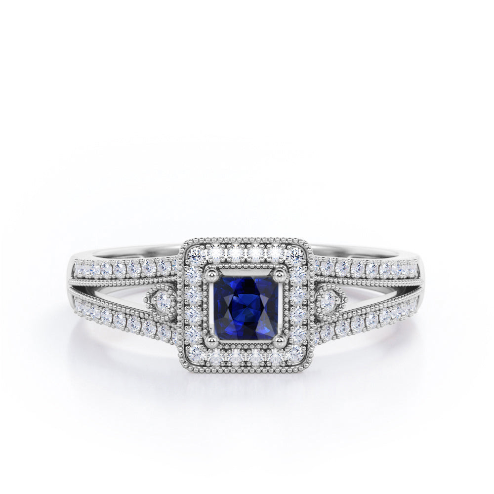 Split-Shanked Pave 1.55 Carat Princess Cut Blue Sapphire and diamond Milgrain-Bordered Halo Engagement Ring in White Gold