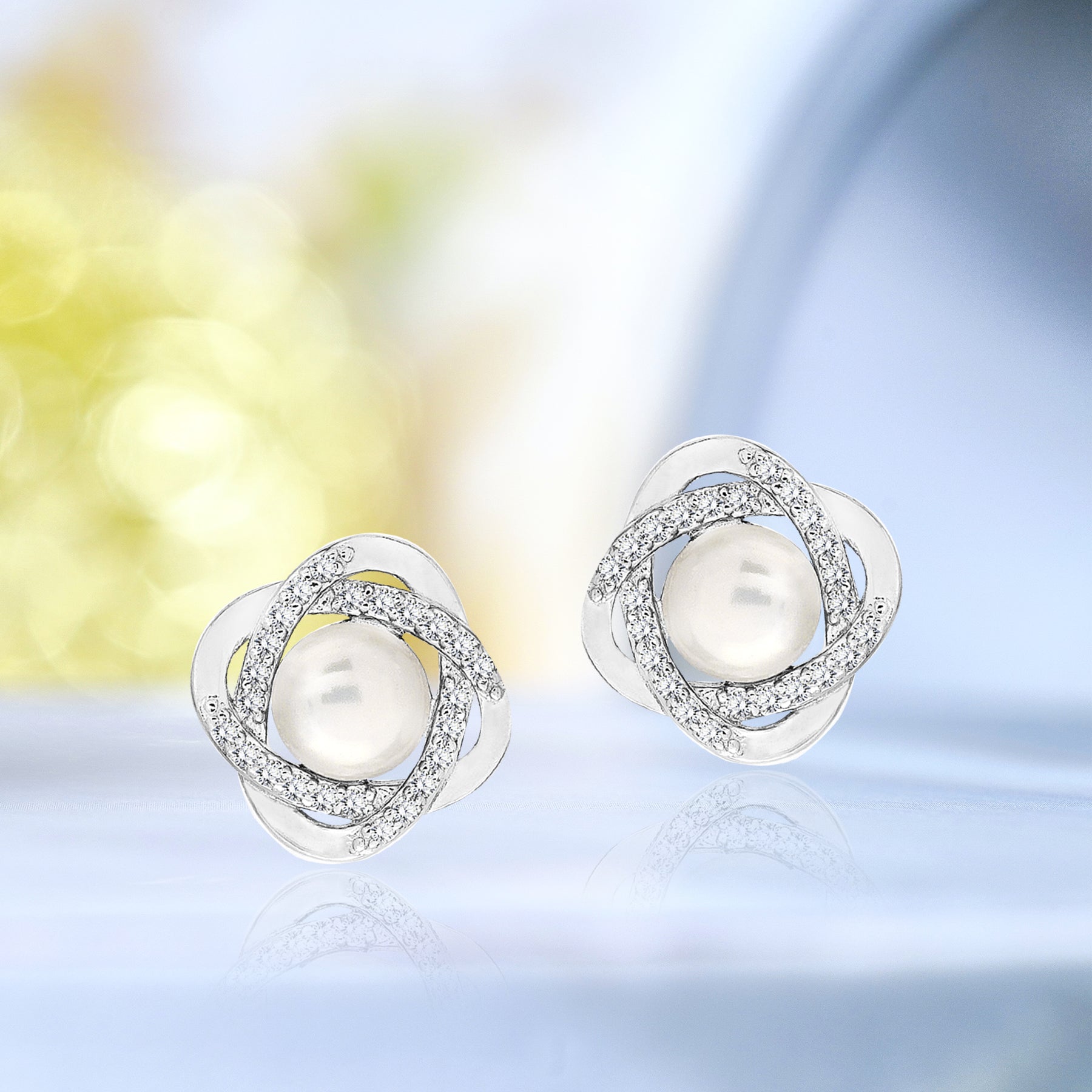 Twirling Flower and Pearl Stud Earrings for Women in Silver