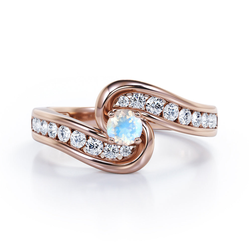 Spinning 0.7 carat Round Moonstone and Moissanite Channel Engagement Ring in Rose Gold