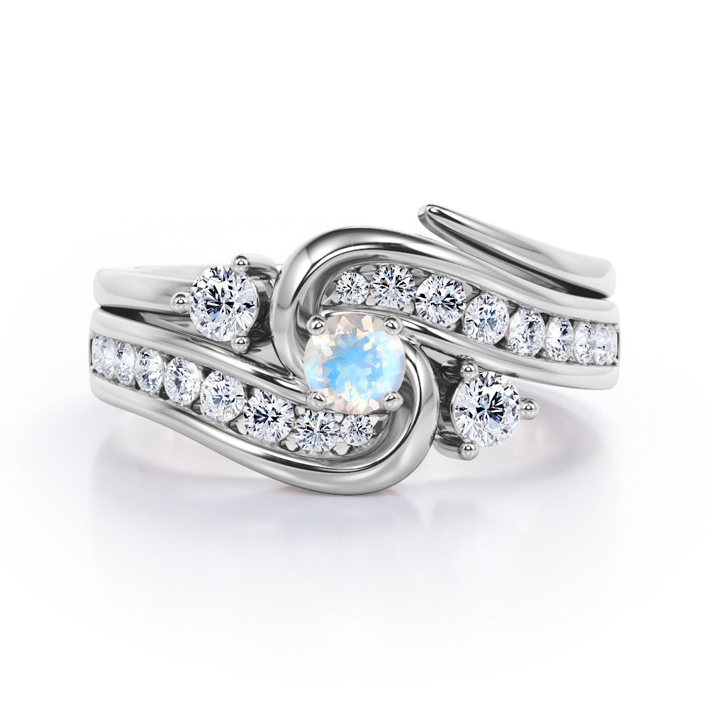 Twisted Tension - Prong 1 TCW Round Brilliant Cut Moonstone and Moissanite - Flush Channel Wedding Set in White Gold