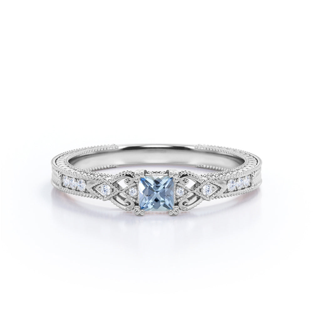 1.10 Carat Princess Cut Aquamarine And Diamond Vintage Milgrain Engagement Ring In White Gold.