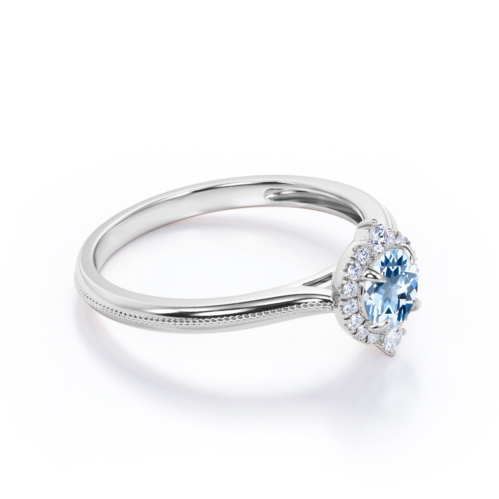 1.15 Carat Round Cut Aquamarine And Diamond Halo Engagement Ring In White Gold