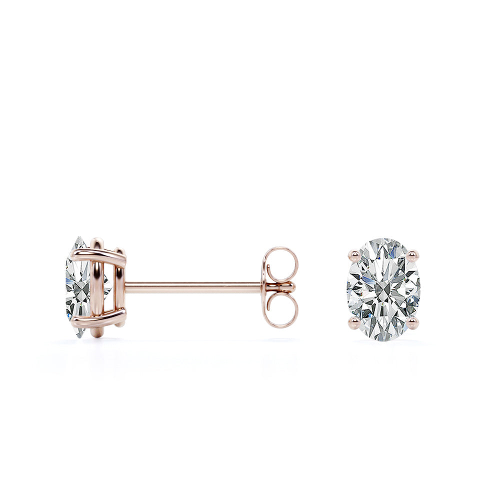 2 Carat Oval Cut Moissanite Solitaire Stud Earrings - 4 Prong - In 18K Rose Gold Plating Over Silver.