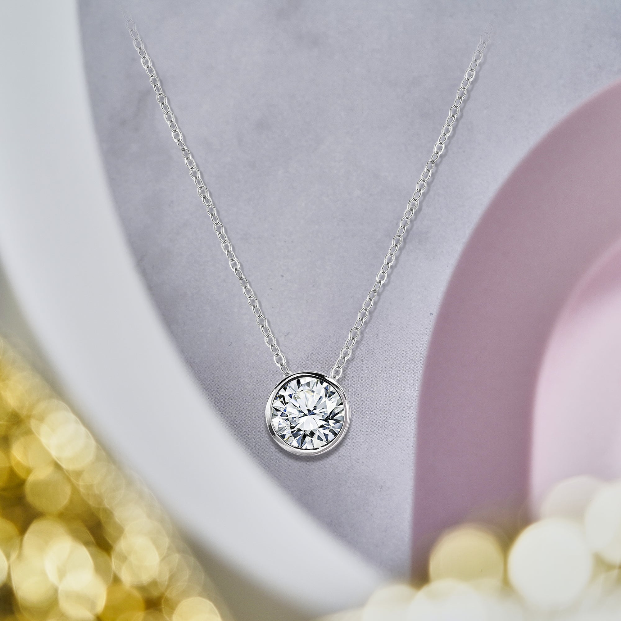 Modern 1 Carat Round Cut Moissanite Bezel Set Slider Pendant Necklace in 18K White Gold over Silver