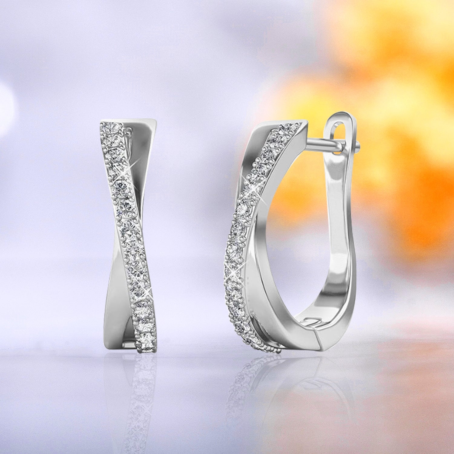 Half-Carat Criss Crossed Moissanite Huggie Earrings in 18K White Gold over Silver