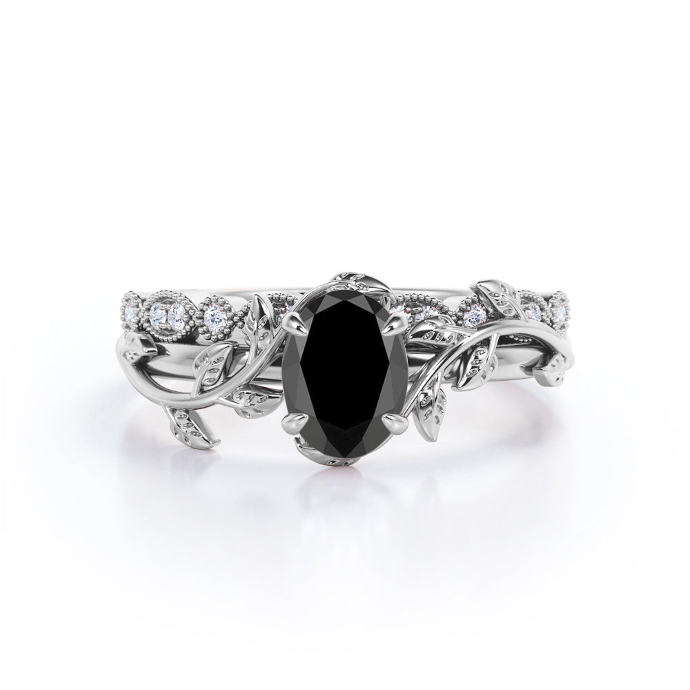 1.25 carat oval cut Black Diamond butterfly style bridal set in white gold